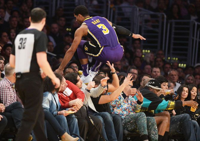 Los Angeles Lakers' guard Josh Hart (3) leaps over the first row of fans in the second half against the Minnesota Timberwolves at Staples Center during their NBA match on November 8