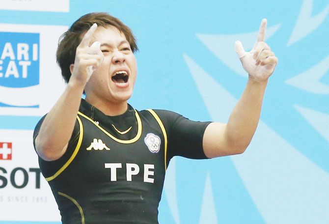 Taiwan's Lin Tzu Chi reacts after setting a new Asian Games record of 116kg in the women's 63kg snatch weightlifting competition at the Moonlight Festival Garden during the 17th Asian Games in Incheon on September 23, 2014