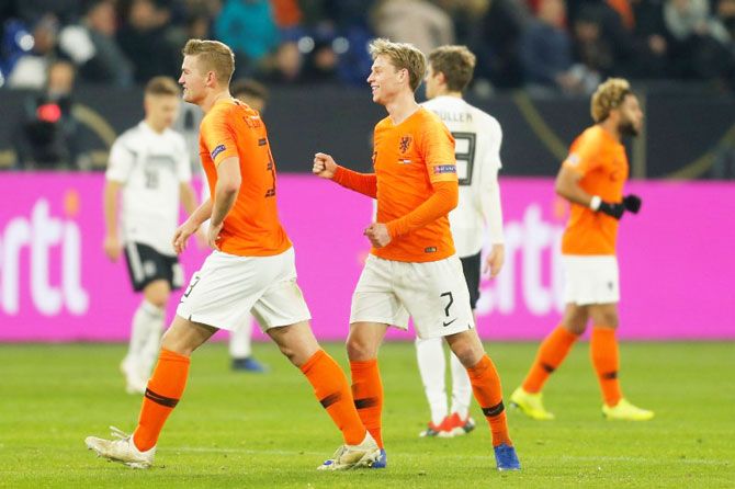 Netherlands' Frenkie De Jong and Matthijs de Ligt celebrate after their UEFA Nations League, League A, Group 1 match against Germany on Monday