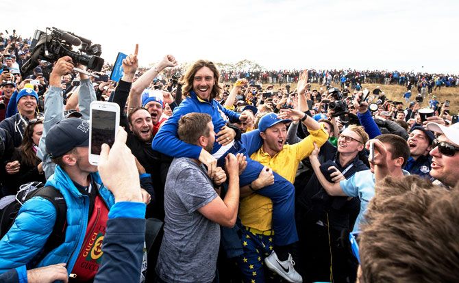 Tommy Fleetwood celebrates victory with the crowd after the singles matches of the 2018 Ryder Cup at Le Golf National in Paris on Sunday