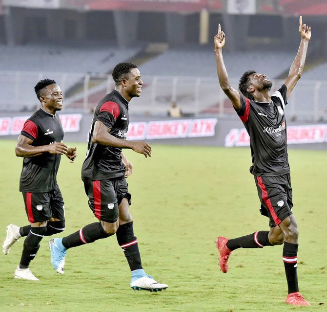 North East United FC Rowllin Borges celebrates a goal with teammates after scoring against ATK during their ISL match in Kolkata on Thursday
