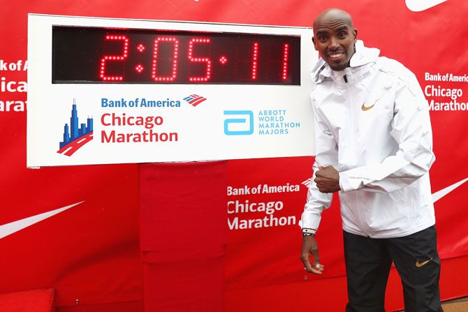 Great Britain's Mo Farah celebrates winning the men's race setting a new European record in 2 hours,five minutes and 11 seconds during the 2018 Bank of America Chicago Marathon in Chicago, Illinois, on Sunday