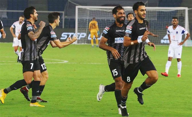 ATK players celebrate on scoring a goal against Delhi Dynamos on Wednesday