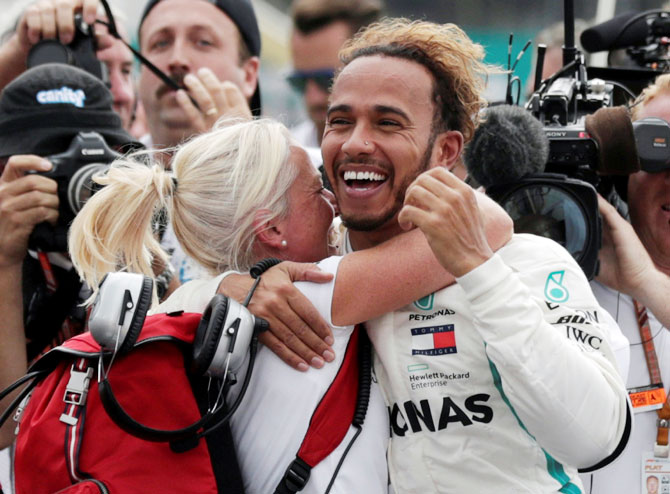 Mercedes' Lewis Hamilton celebrates after winning the World Championship in Mexico on Sunday