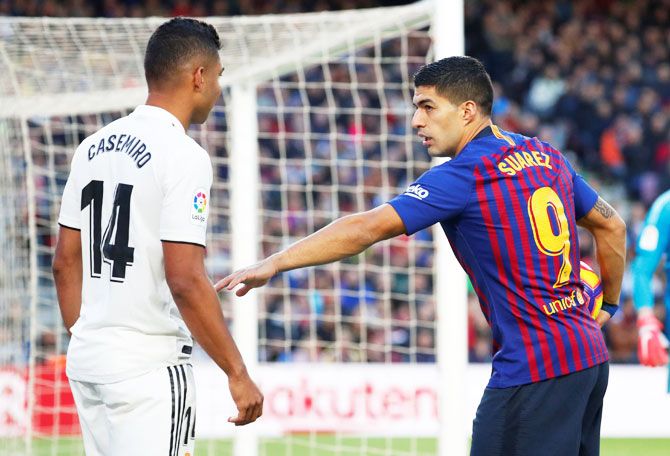 Barcelona's Luis Suarez gestures to Real Madrid's Casemiro during their 'Clasico' match at Camp Nou in Barcelona on Sunday