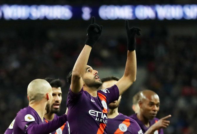 Manchester City's Riyad Mahrez celebrates after scoring his team's first goal against Tottenham Hotspur during their English Premier League match at Wembley Stadium in London on Monday