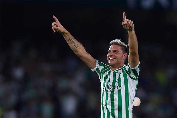 Real Betis' Joaquin celebrates on scoring against Sevilla