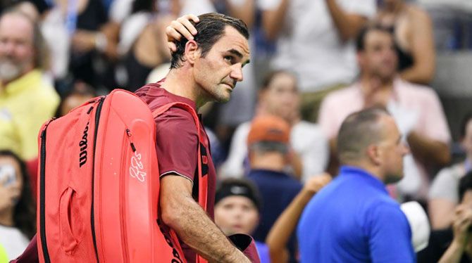 Switzerland's Roger Federer walks off the court after his loss to Australia's John Millman in their round of 16 match of the US Open on Monday
