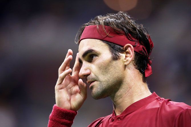 Roger Federer reacts during his US Open fourth round match against John Millman