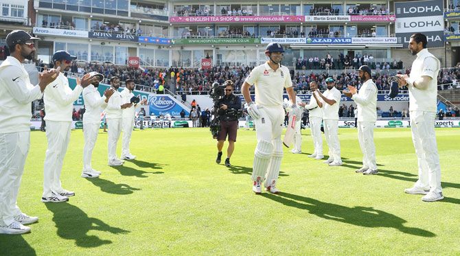England'S Alastair Cook is given a guard of honour as he walks out to bat on Day 1 of the 5th Test at The Kia Oval in London on Friday