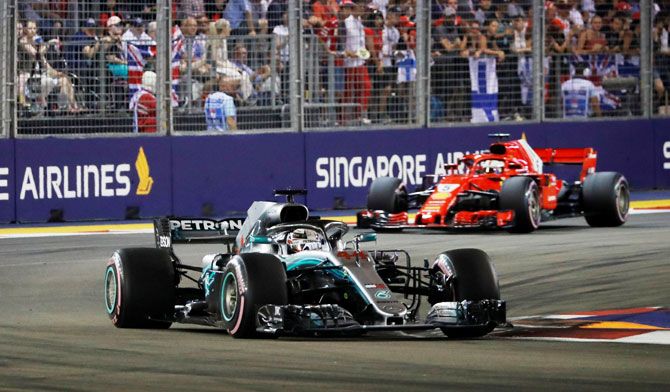 Mercedes' Lewis Hamilton leads during the race at the Singapore F1 GP on Sunday