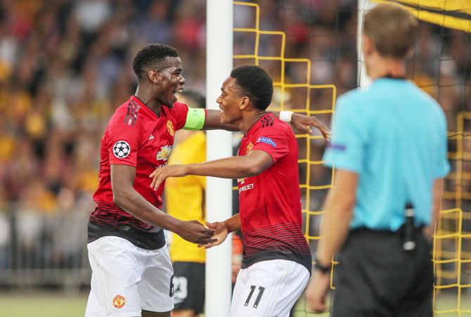 Manchester City's Paul Pogba and Anthony Martial celebrate on scoring a goal against Young Boys during their Champions League match on Wednesday