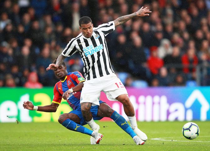 Crystal Palace's Wilfried Zaha in action with Newcastle United's Kenedy