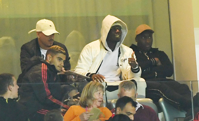Manchester United's Paul Pogba watches the League Cup Third Round match between Manchester United and Derby County from the stands on Tuesday