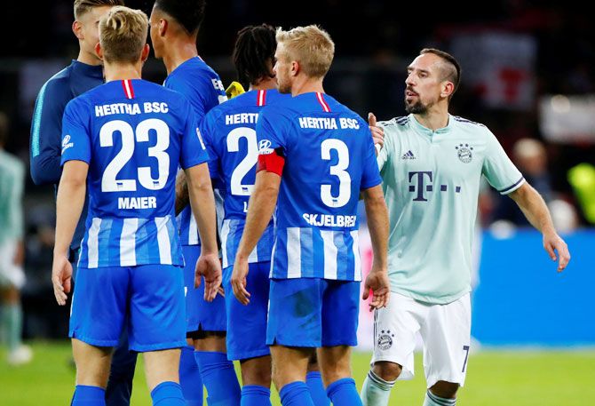 Bayern Munich's Franck Ribery breaks into an argument with Hertha Berlin players after their Bundesliga match at Olympiastadion, Berlin, on Saturday