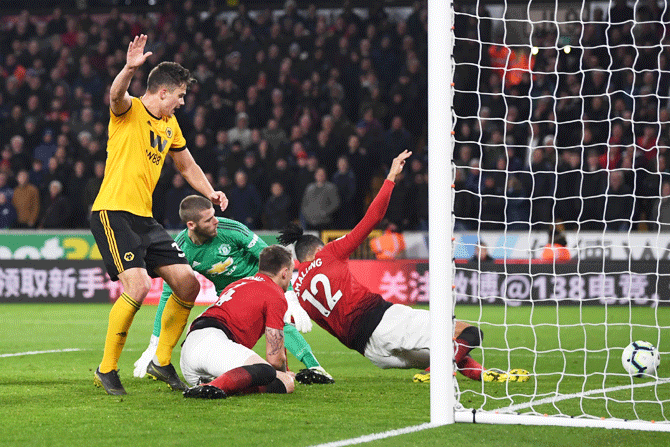 Manchester United's Chris Smalling scores an own goal for Wolverhampton Wanderers' second goal