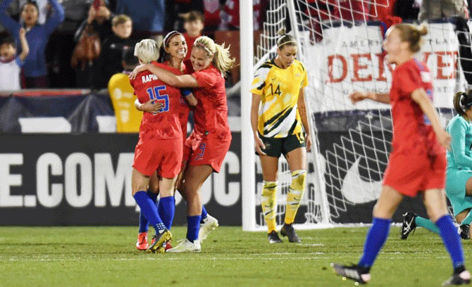 United States forward Alex Morgan (center) celebrates with forward Megan Rapinoe (15) and midfielder Lindsey Horan (9) after scoring against Australia during an International Friendly Women's Soccer match at Dick's Sporting Goods Park in Commerce City, Colorado, on Thursday
