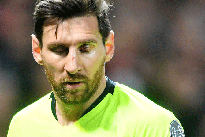 Barcelona captain Lionel Messi was left with a bloodied nose after a challenge by Mancehster Umited's Chris Smalling during their UEFA Champions League quarter-final first leg match at Old Trafford in Manchester on Wednesday