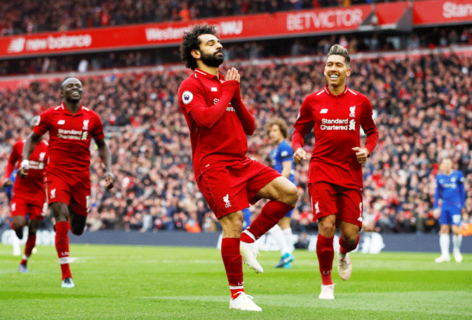 Liverpool's Mohamed Salah celebrates scoring their second goal against Chelsea at Anfield on Sunday, April 14
