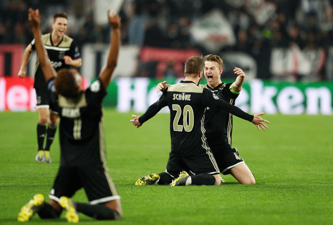 Ajax's Matthijs de Ligt celebrates teammate Lasse Schone after knocking Juventus out of the UEFA Champions League after their 2-1 win in the quarter-final second leg match at Allianz Stadium in Turin on Tuesday