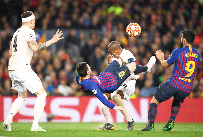 Barcelona's Lionel Messi attempts a over head kick on goal during the UEFA Champions League quarter-final second leg match against Manchester United at Camp Nou in Barcelona on Sunday