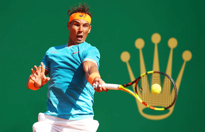 Spain's Rafael Nadal plays a forehand against Spain's Roberto Bautista Agut in their second round match of the Rolex Monte-Carlo Masters at Monte-Carlo Country Club in Monte-Carlo, Monaco, on Wednesday