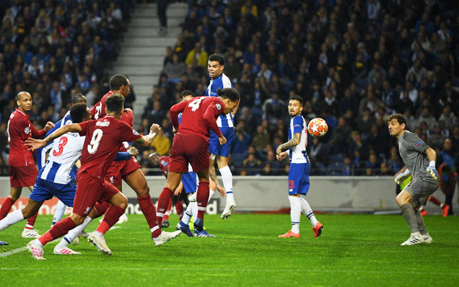 Liverpool's Virgil van Dijk scores his team's fourth goal against Porto
