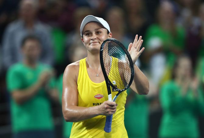 Australia's Ashleigh Barty celebrates winning her match against Belarus' Victoria Azarenka during their Fed Cup World Group semi-final at Pat Rafter Arena Brisbane, Australia, on Saturday