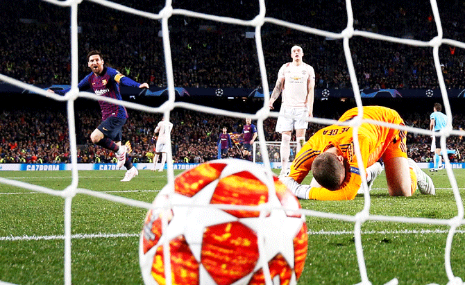 Barcelona's Lionel Messi scores the second goal as Manchester United's David de Gea reacts during their Champions League quarter-final second leg  match at Camp Nou, Barcelona, on Tuesday, April 16
