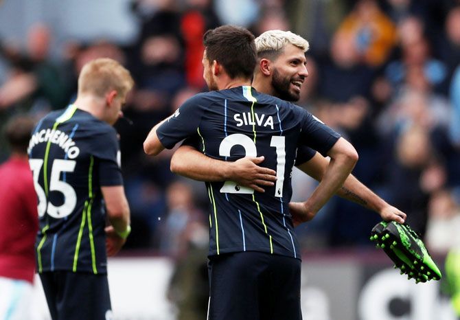 Manchester City's Sergio Aguero and David Silva celebrate after the match against Burnley at Turf Moor in Burnley