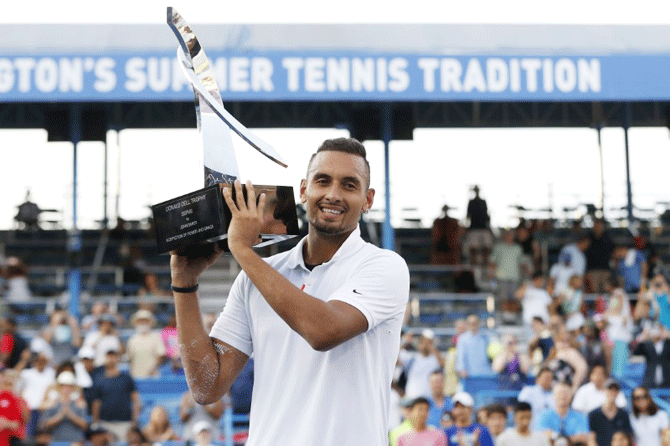 Australia's Nick Kyrgios celebrates with the Donald Dell Trophy after defeating Russia's Daniil Medvedev to win the 2019 Citi Open at William HG FitzGerald Tennis Center in Washinton, D.C. on Sunday