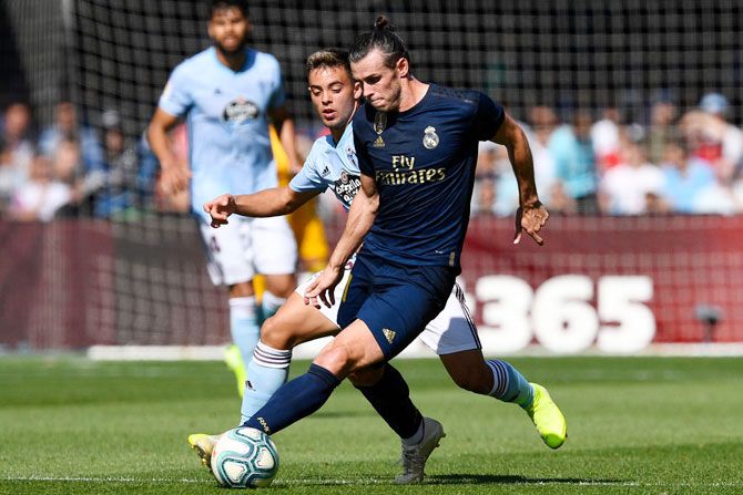 RC Celta's David Costas and Real Madrid's Gareth Bale vie for possession during their Liga match at Abanca-Balaídos in Vigo, Spain, on Sunday