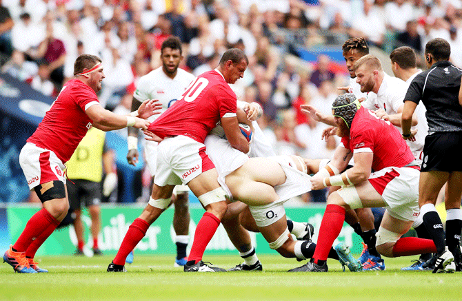 England's Charlie Ewels in action with Wales' Aaron Shingler during the Rugby World Cup warm-up match at Twickenham Stadium in Twickenham, Britain, on Sunday, August 11