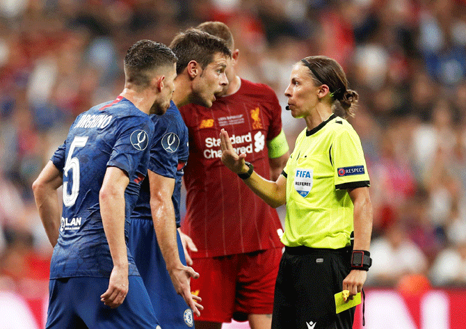 Chelsea's Cesar Azpilicueta argues as referee Stephanie Frappart shows him a yellow card during the UEFA Super Cup match against Liverpool at Vodafone Arena in Istanbul, Turkey, on Wednesday, August 14