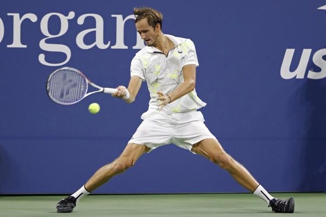 Daniil Medvedev hits a forehand against Feliciano Lopez.