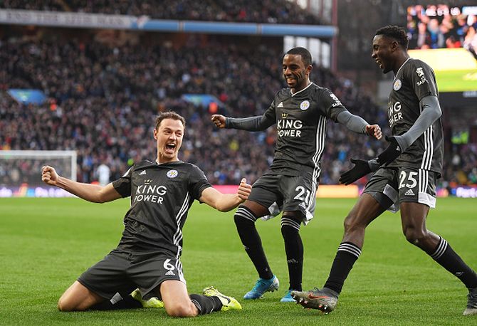 Leicester City's Jonny Evans celebrates after scoring his team's third goal against Aston Villa at Villa Park in Birmingham on Sunday