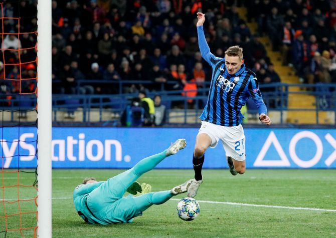 Atalanta's Timothy Castagne scores their first goal which was awarded after a VAR review during their Champions League Group C match against Shakhtar Donetsk at Metalist Stadium in Kharkiv, Ukraine
