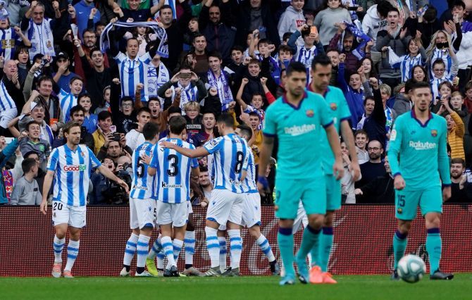 Real Sociedad's Mikel Oyarzabal celebrates  with teammates after scoring their opening goal