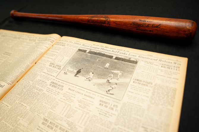 Babe Ruth's 500th home run bat is shown next to a copy of the next days New York Times before it goes up for auction by SCP Auctions in Laguna Niguel, California, USA