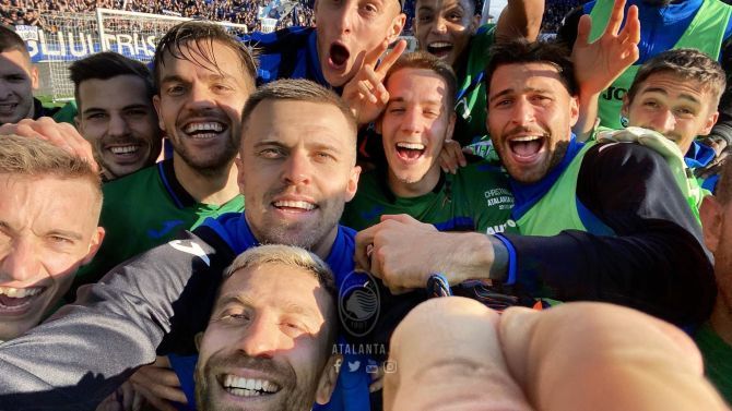 Atalanta players celebrate after their win over AC Milan on Sunday
