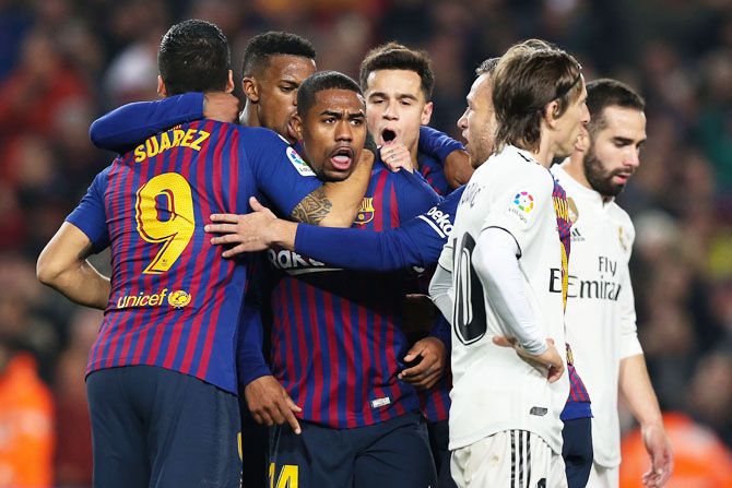 FC Barcelona's Malcom celebrates with teammates after scoring the equaliser during the Copa del semi-final first leg match against Real Madrid at Nou Camp in Barcelona on Wednesday
