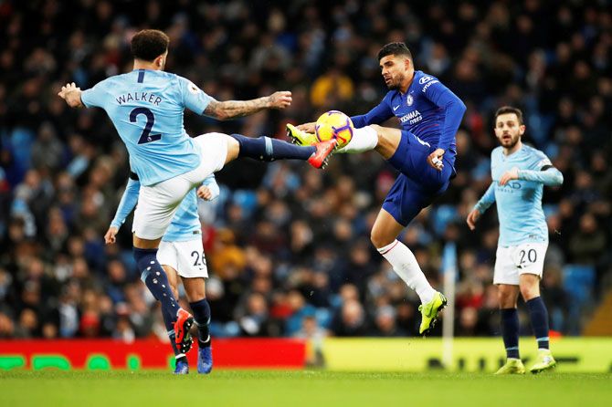 Manchester City's Kyle Walker and Chelsea's Emerson Palmieri vie for possession