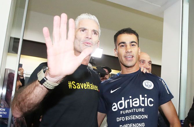 Refugee Bahraini footballer Hakeem al-Araibi with former Australian football captain and commentator Craig Foster as he arrives at Melbourne Airport in Melbourne, on Tuesday