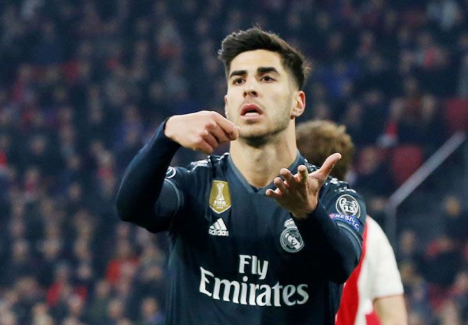 Real Madrid's Marco Asensio celebrates scoring their second goal against Ajax Amsterdam at Johan Cruijff Arena in Amsterdam 