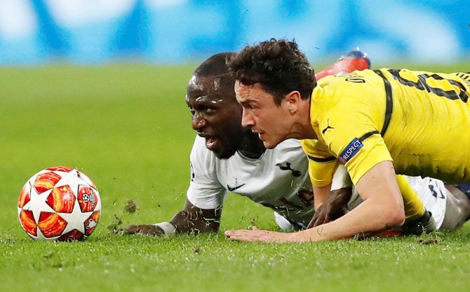 Borussia Dortmund's Thomas Delaney and Tottenham's Moussa Sissoko in action during their Champions League Round of 16 first leg match 