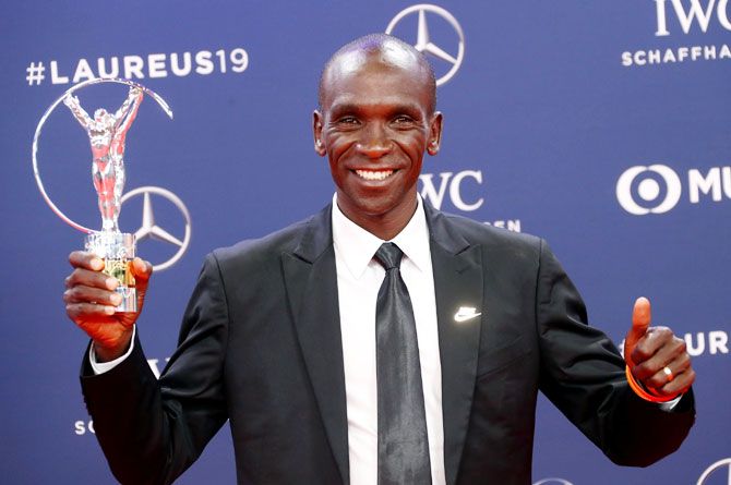 Eliud Kipchoge poses after winning the Exceptional Achievement Award