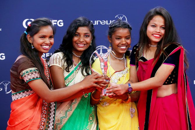 Yuwa-India's Neeta Kumari, Hema Kumari, Konika Kumari, and Radha Kumari pose after winning the Sport for Good award 