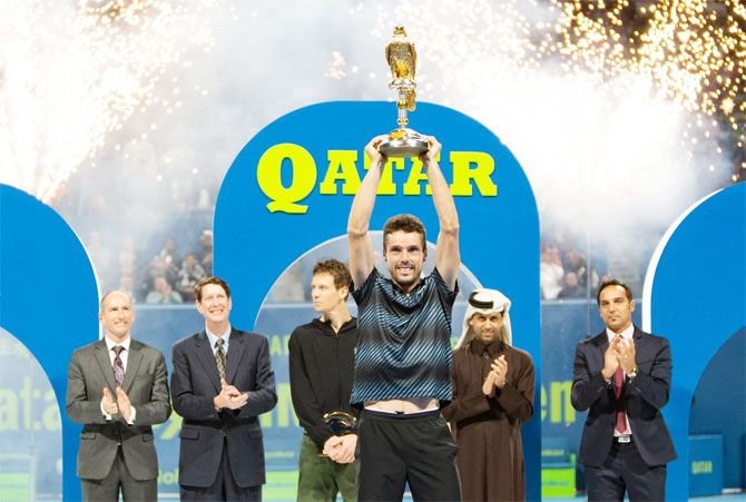 Spain's Roberto Bautista Agut celebrates after defeating Tomas Berdych to win the Qatar Open title on Saturday