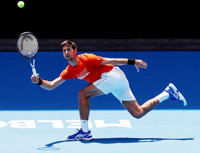 Serbia's Novak Djokovic at a practice match against Britain's Andy Murray at Melbourne Park in Melbourne on Thursday