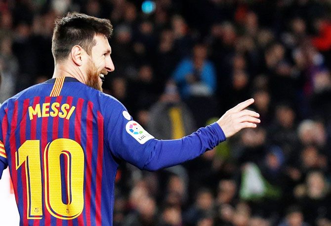 Barcelona's Lionel Messi celebrates scoring their second goal against Eibar to net his 400th goal in La Liga at Camp Nou in Barcelona on Sunday 